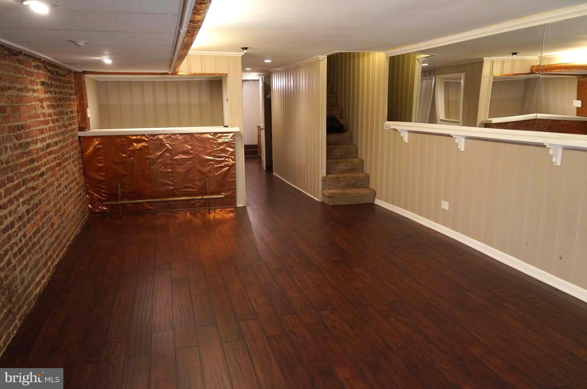 3538 Keswick Road Baltimore, MD 21211 - Photo 19 of 30 Large open finished basement w/ bar