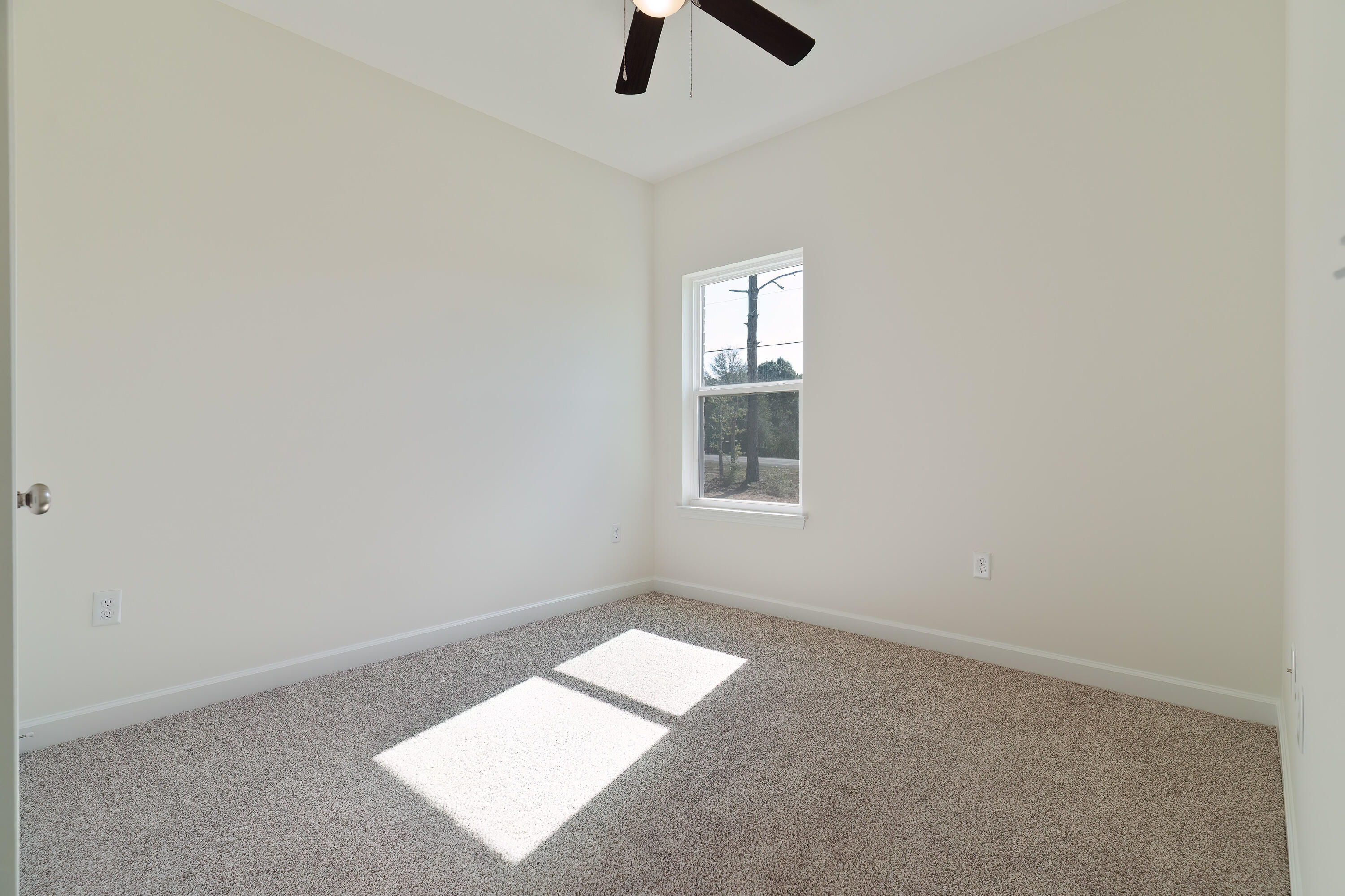 2831 Blackbird Court Crestview, FL 32539 - Photo 16 of 19 an empty room with windows and entrance