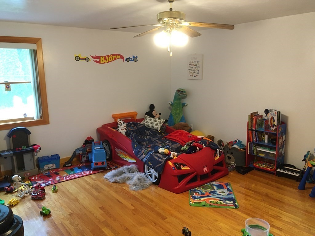 116-120 Thompson Road Webster, MA 01570 - Photo 11 of 39 a bed room with a bed and a chandelier