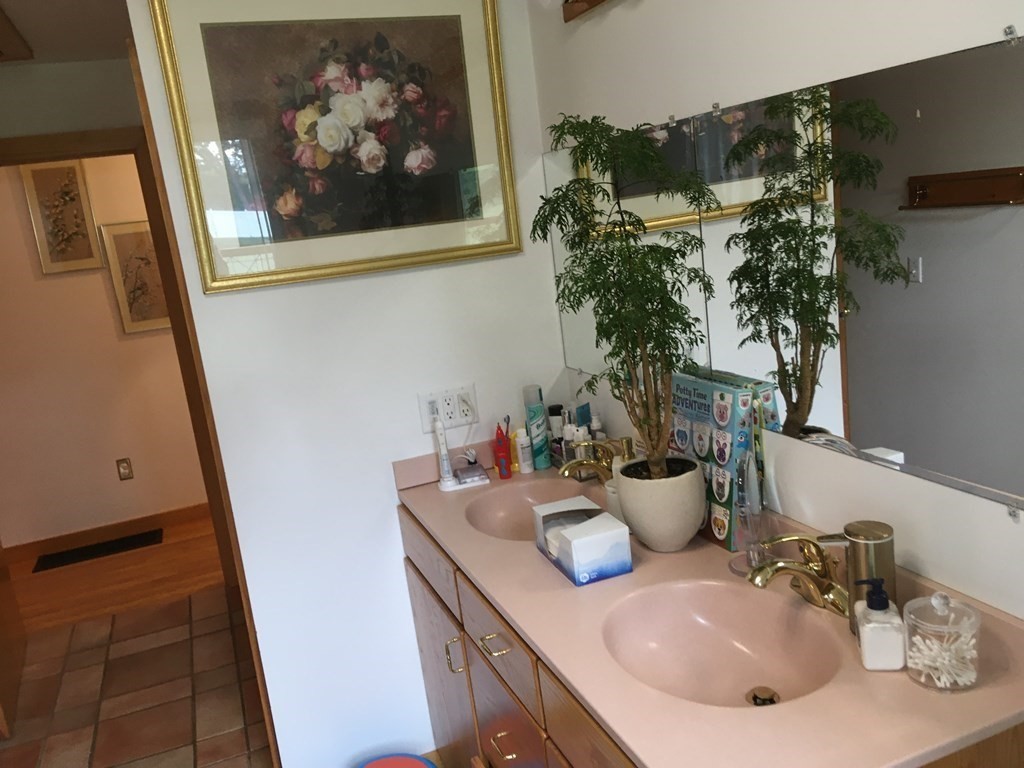 116-120 Thompson Road Webster, MA 01570 - Photo 12 of 39 a bathroom with a sink and a mirror