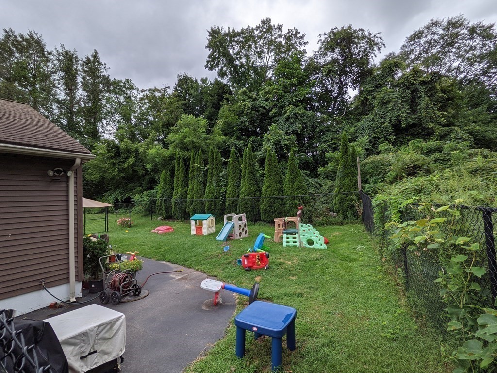 116-120 Thompson Road Webster, MA 01570 - Photo 27 of 39 a backyard of a house with seating space