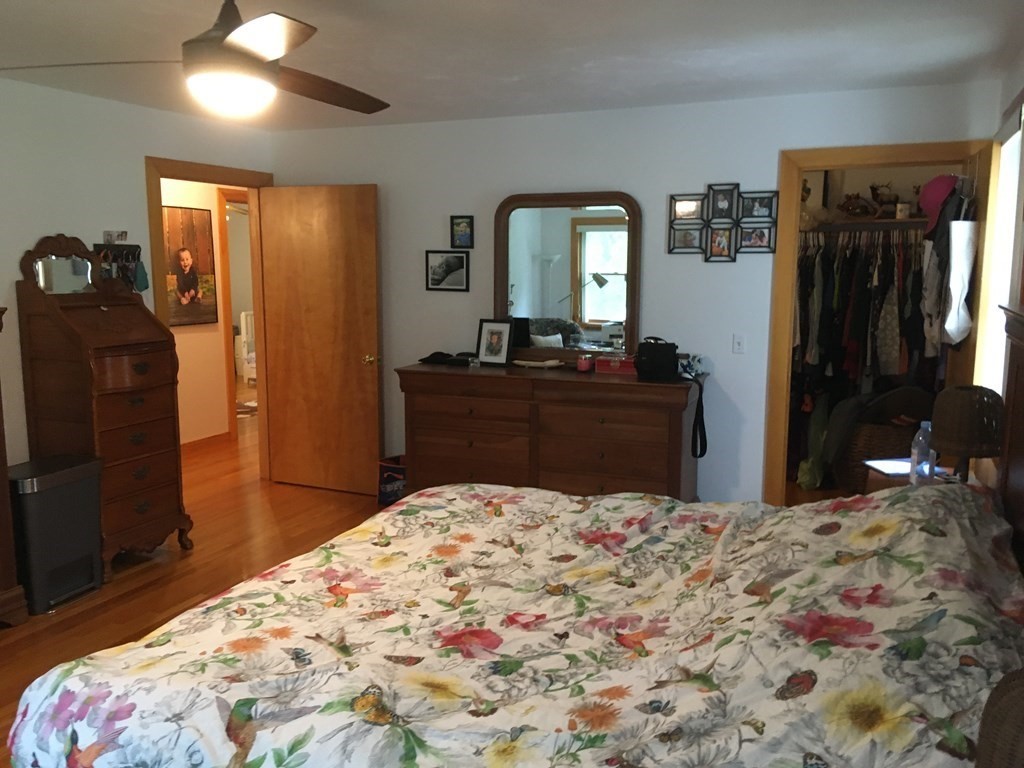 116-120 Thompson Road Webster, MA 01570 - Photo 5 of 39 a bedroom with a bed and a dresser in it