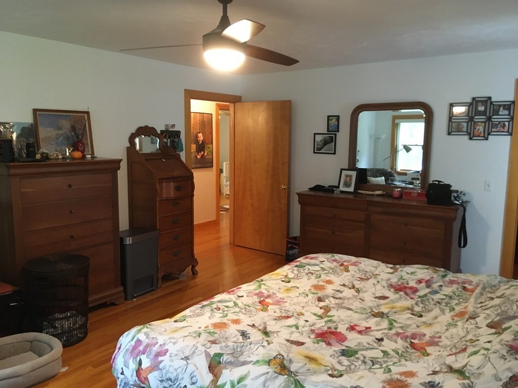 116-120 Thompson Road Webster, MA 01570 - Photo 6 of 39 a bedroom with a bed and a dresser