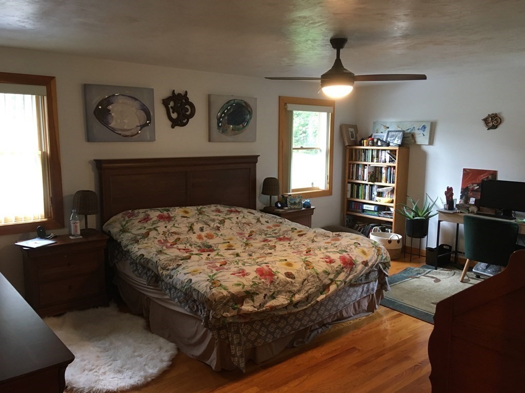116-120 Thompson Road Webster, MA 01570 - Photo 7 of 39 a bedroom with a bed and dresser with wooden floor