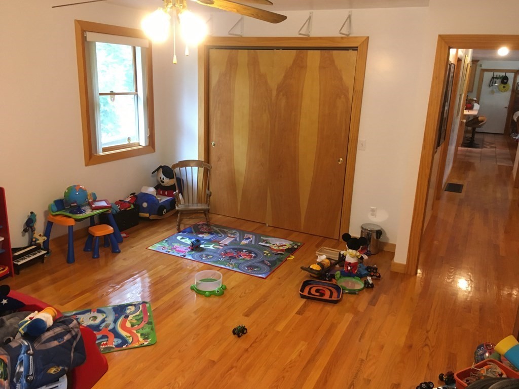 116-120 Thompson Road Webster, MA 01570 - Photo 10 of 39 a room with furniture and wooden floor