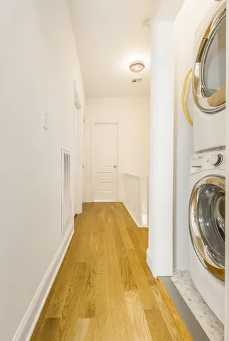 a view of a bedroom with washer and dryer