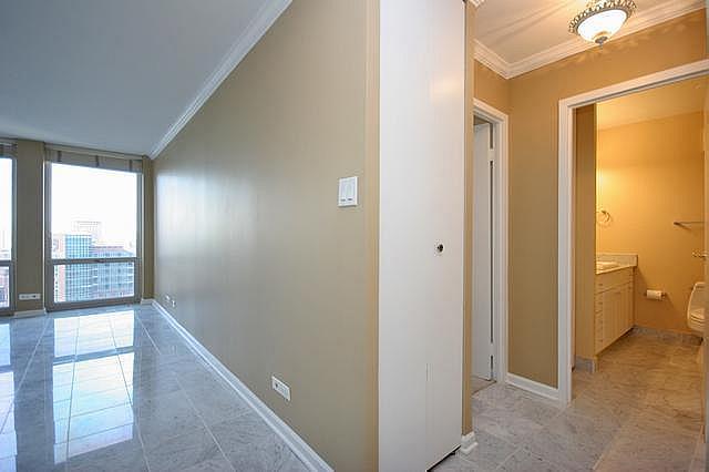 111 East Chestnut Street, Unit 31J Chicago, IL 60611 - Photo 2 of 9 a view of an empty room and window