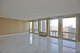 111 East Chestnut Street, Unit 31J Chicago, IL 60611 - Photo 3 of 9 a view of an empty room with windows
