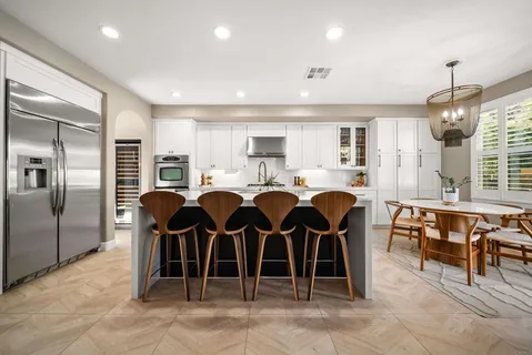 a bedroom with a large bed and a rug