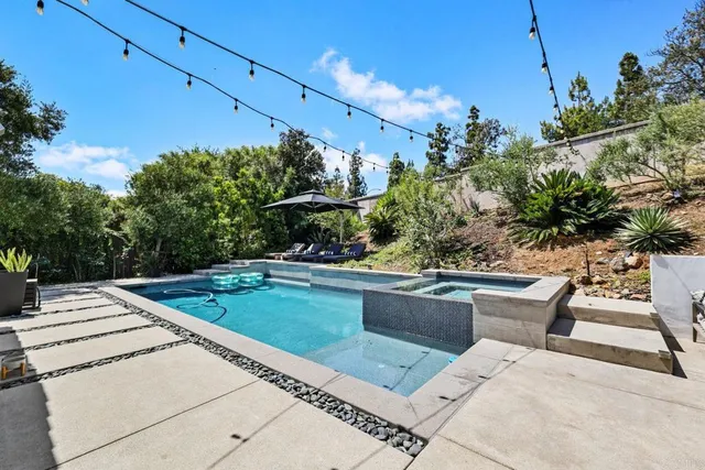 an aerial view of a house with a garden