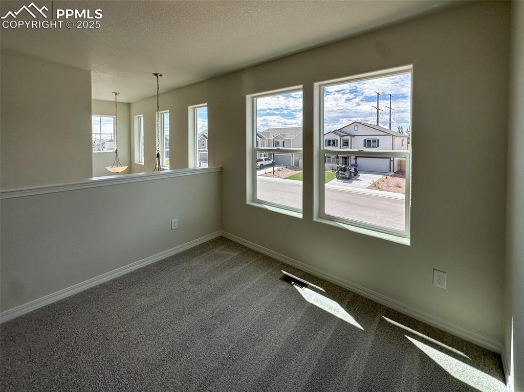 10820 Raylan Way Peyton, CO 80831 - Photo 18 of 35 a view of an empty room with a window