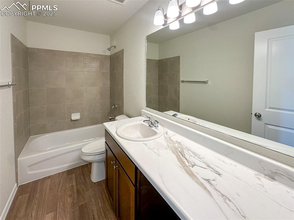 10820 Raylan Way Peyton, CO 80831 - Photo 21 of 35 a bathroom with a sink a toilet and shower