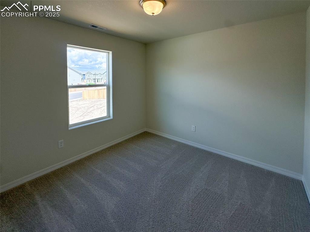 10820 Raylan Way Peyton, CO 80831 - Photo 25 of 35 an empty room with a window