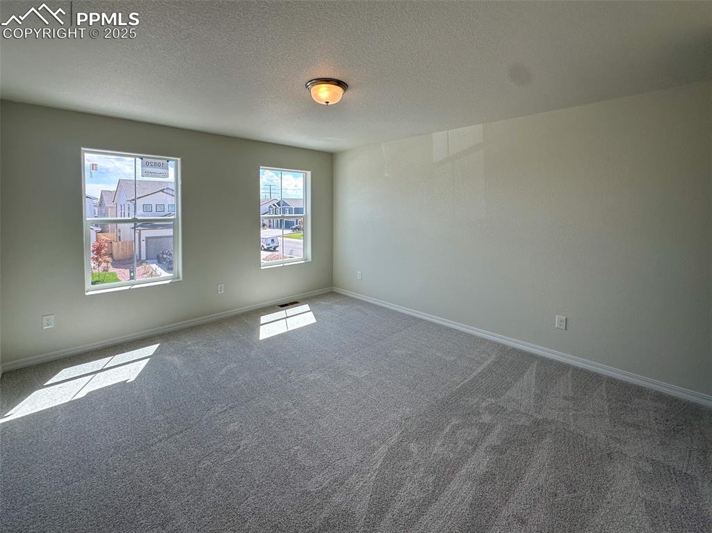 10820 Raylan Way Peyton, CO 80831 - Photo 28 of 35 an empty room with windows