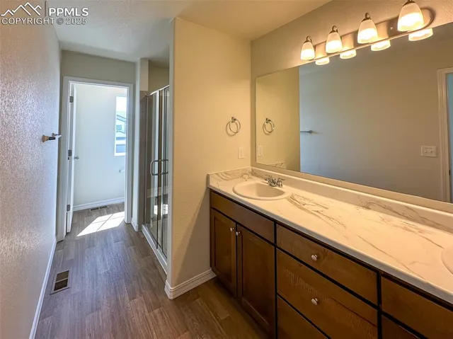 a bathroom with a sink and a large mirror