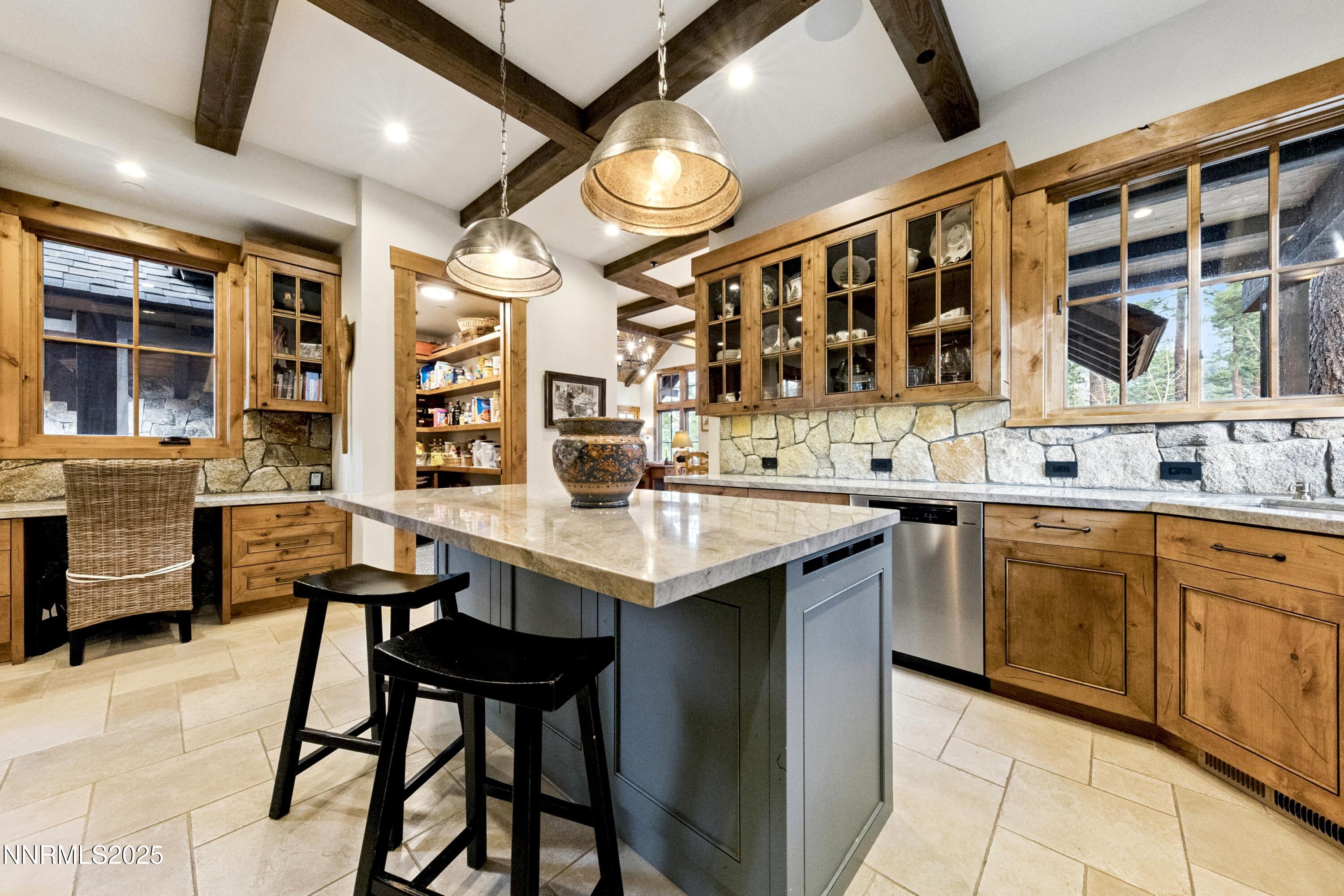 261 Redding Way Carson City, NV 89705 - Photo 22 of 90 a kitchen with a sink and chairs