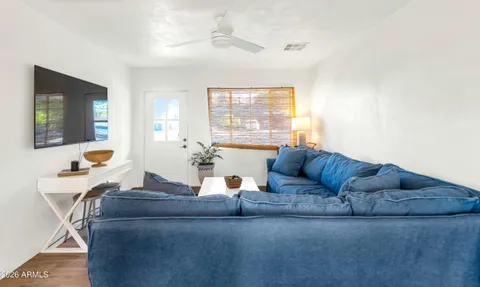 a living room with furniture and a large window