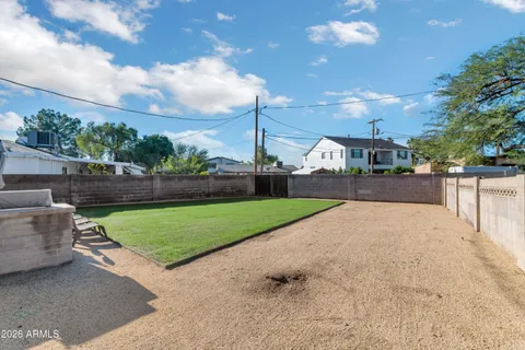 a view of a street with a big yard