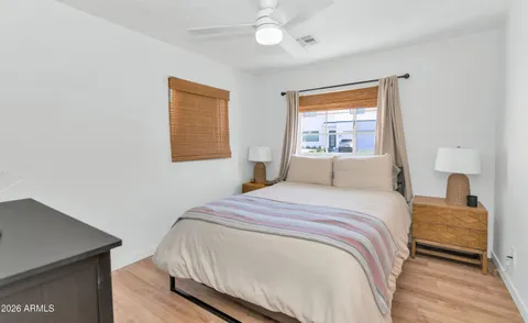 a bedroom with a bed and a window