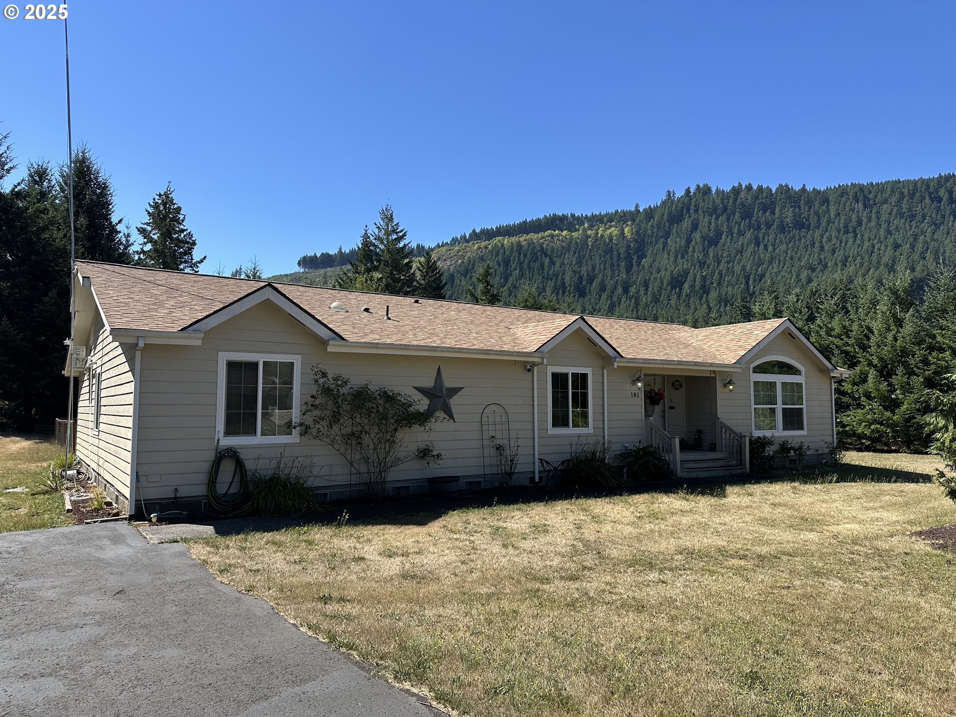 a front view of a house with a yard