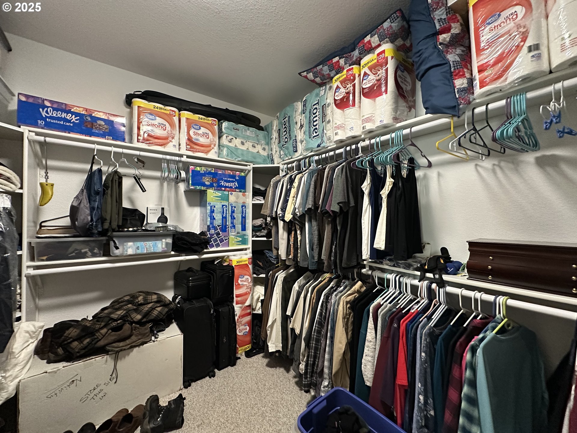 181 Vada Street Carson, WA 98610 - Photo 12 of 30 a view of walk in closet with clothes and shoes