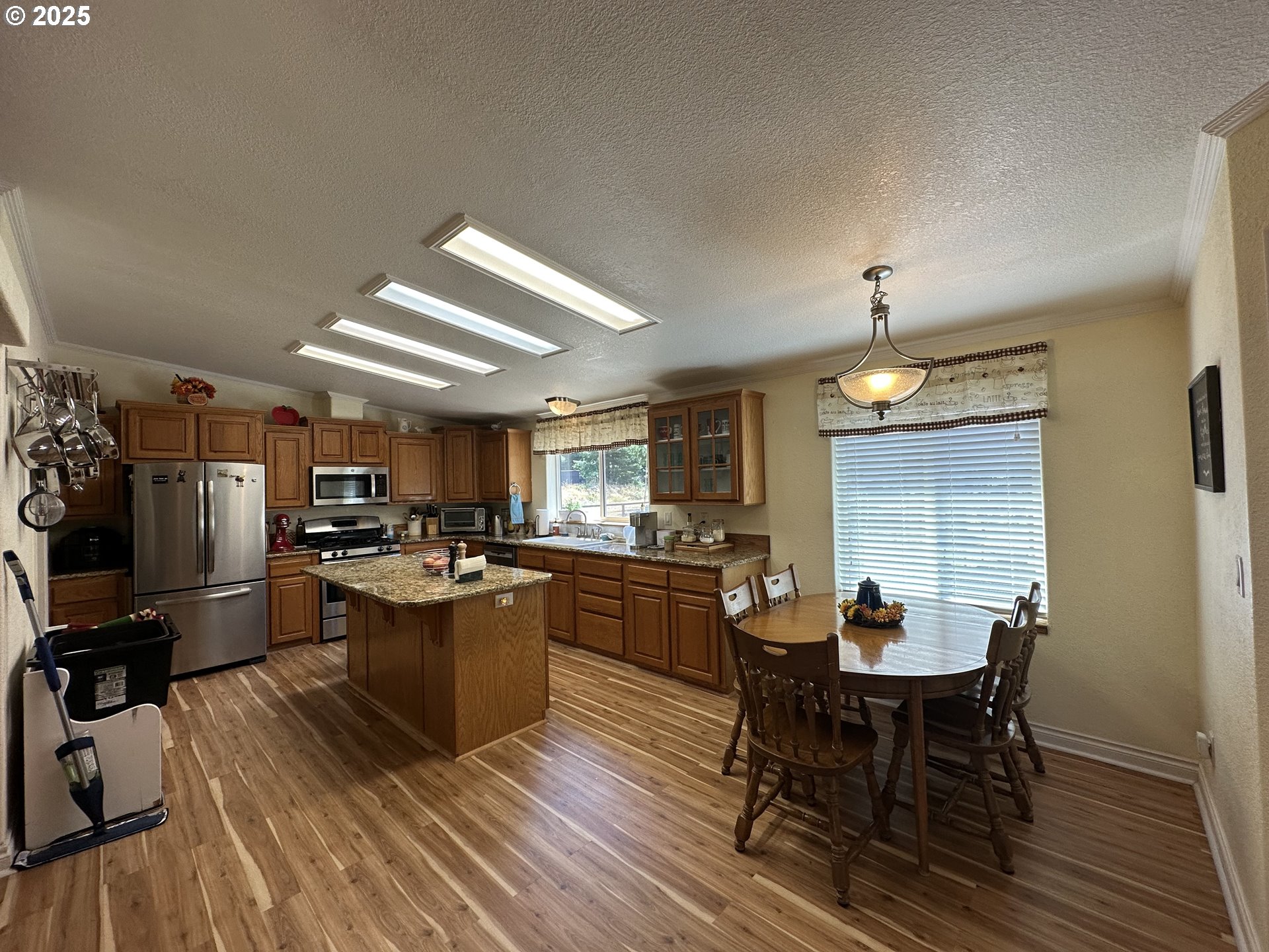 181 Vada Street Carson, WA 98610 - Photo 2 of 30 a view of a dining room with furniture and wooden floor