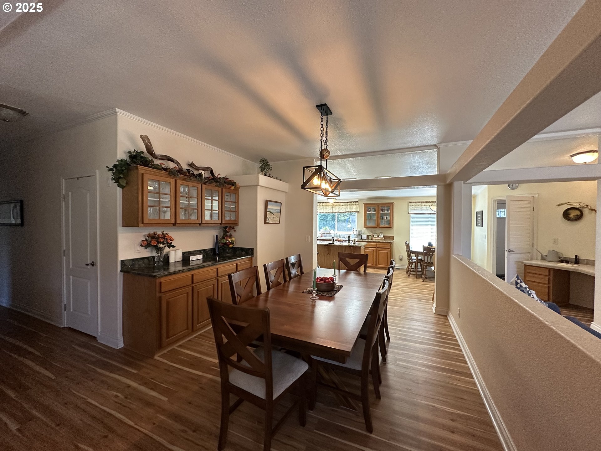 181 Vada Street Carson, WA 98610 - Photo 4 of 30 a view of a dining room with furniture window and wooden floor