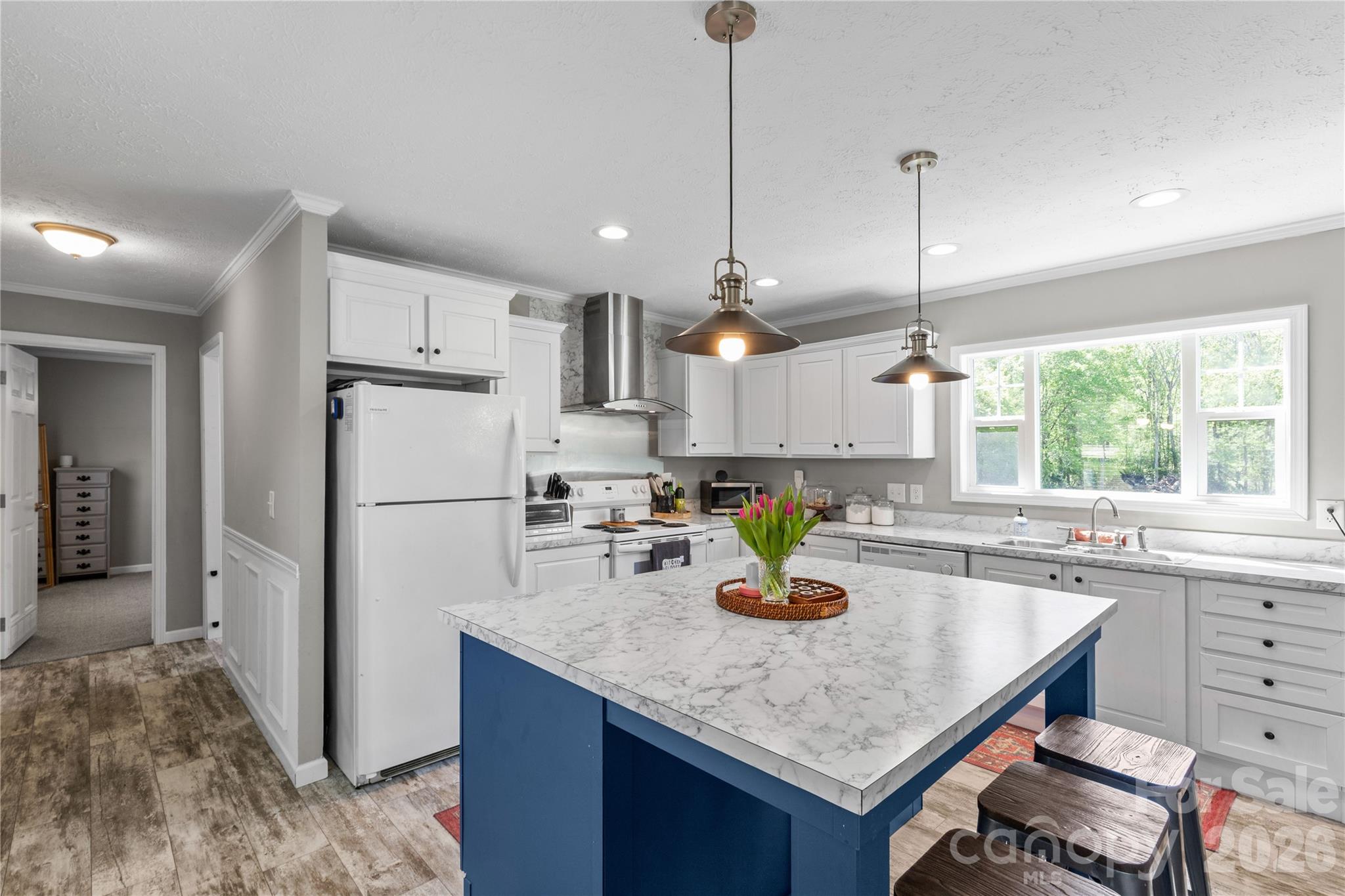 3041 Dr Nichols Road York, SC 29745 - Photo 11 of 26 a kitchen with a refrigerator a sink and wooden floor