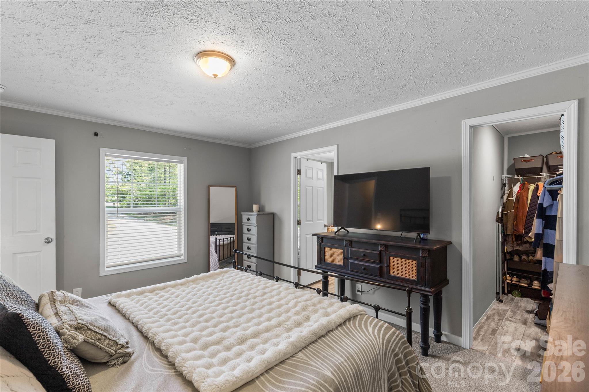 3041 Dr Nichols Road York, SC 29745 - Photo 17 of 26 a bedroom with a bed and a flat screen tv