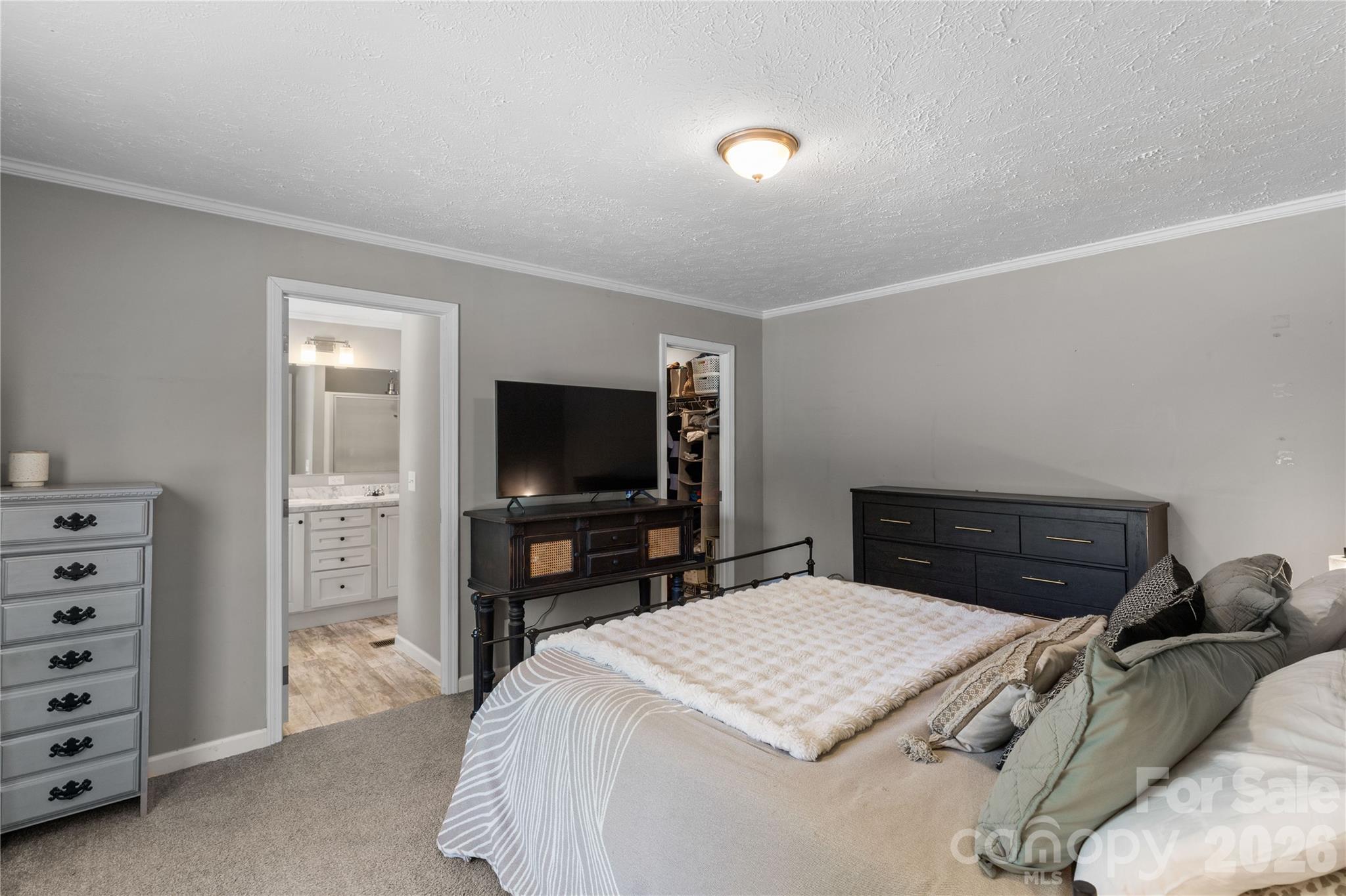 3041 Dr Nichols Road York, SC 29745 - Photo 18 of 26 a bedroom with a bed and a flat screen tv