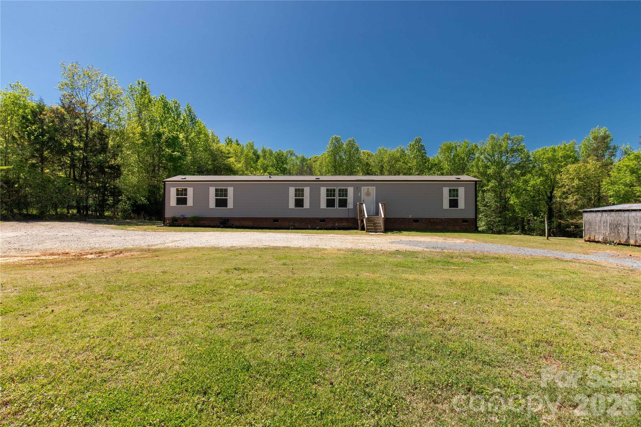 3041 Dr Nichols Road York, SC 29745 - Photo 3 of 26 a view of a swimming pool with an outdoor seating and yard
