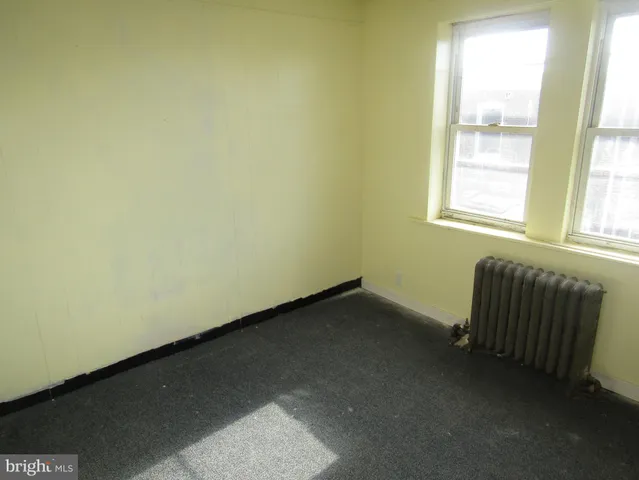 a view of an empty room and window