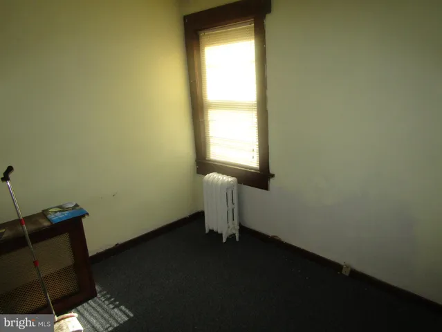 a bathroom with a tub a sink and a shower