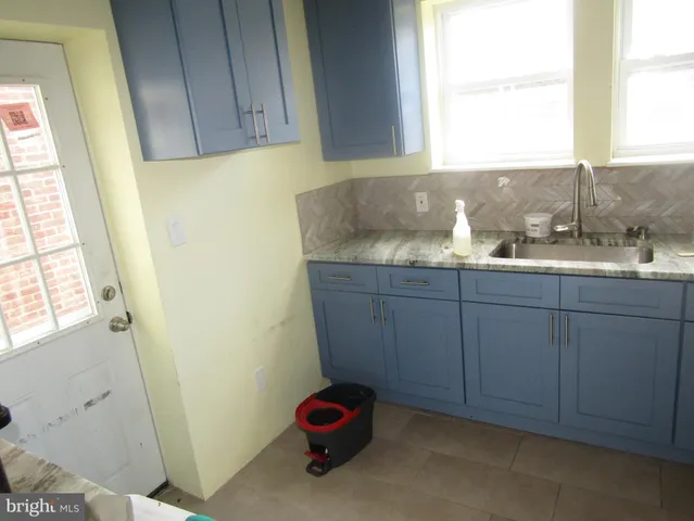 a bathroom with a sink and a window