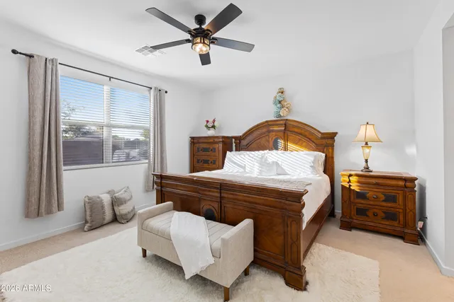 a bathroom with a tub shower sink and mirror