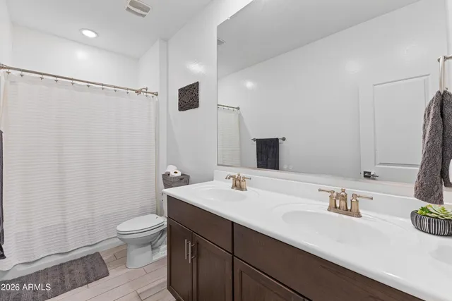 a view of a patio with a table and chairs