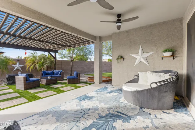 an aerial view of a houses with a swimming pool