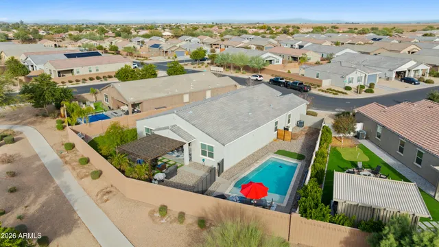 a front view of house with yard and trees