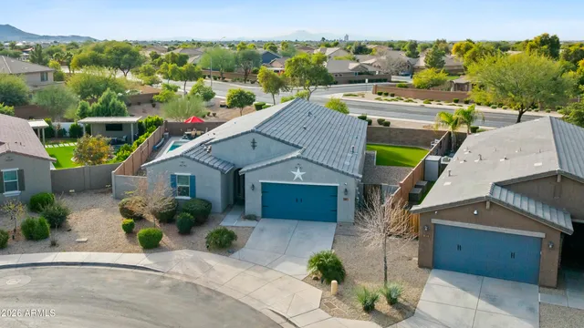 a living room with a couch and chairs