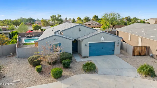 a view of a patio with table and chairs barbeque potted plants and large tree