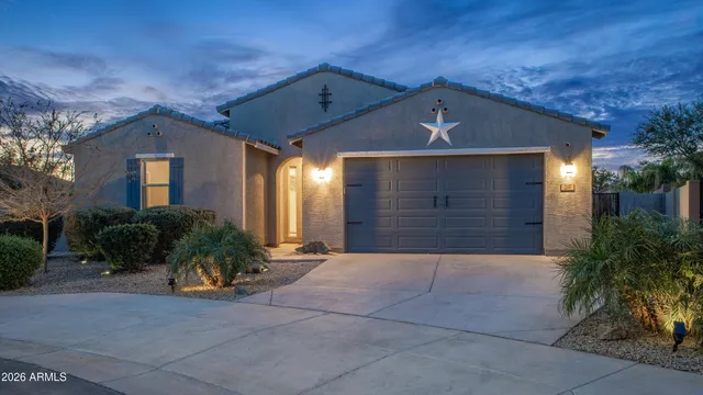 an aerial view of residential houses with outdoor space and ocean view