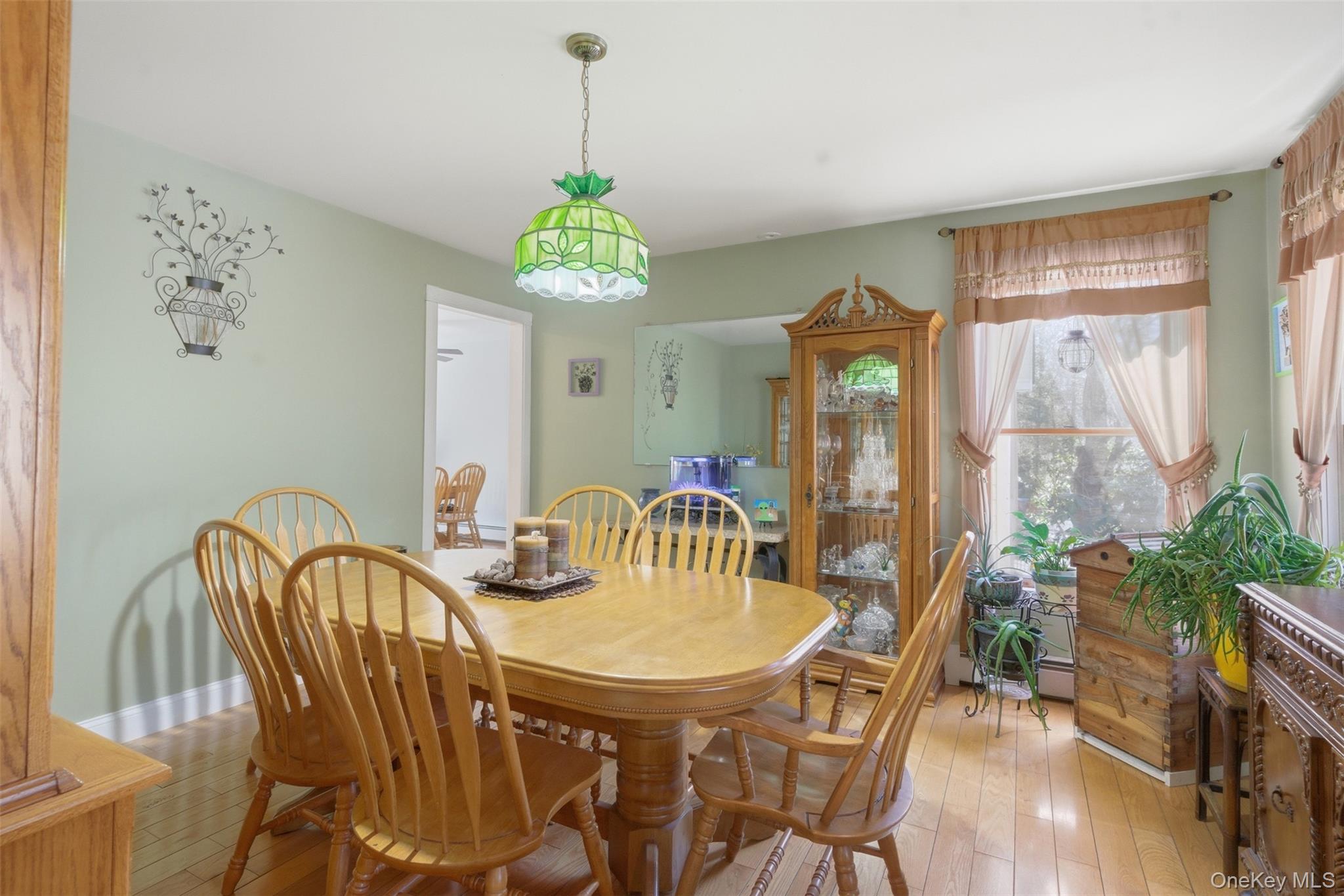1285 Lakes Road Monroe, NY 10950 - Photo 11 of 45 a view of a dining room with furniture window and wooden floor