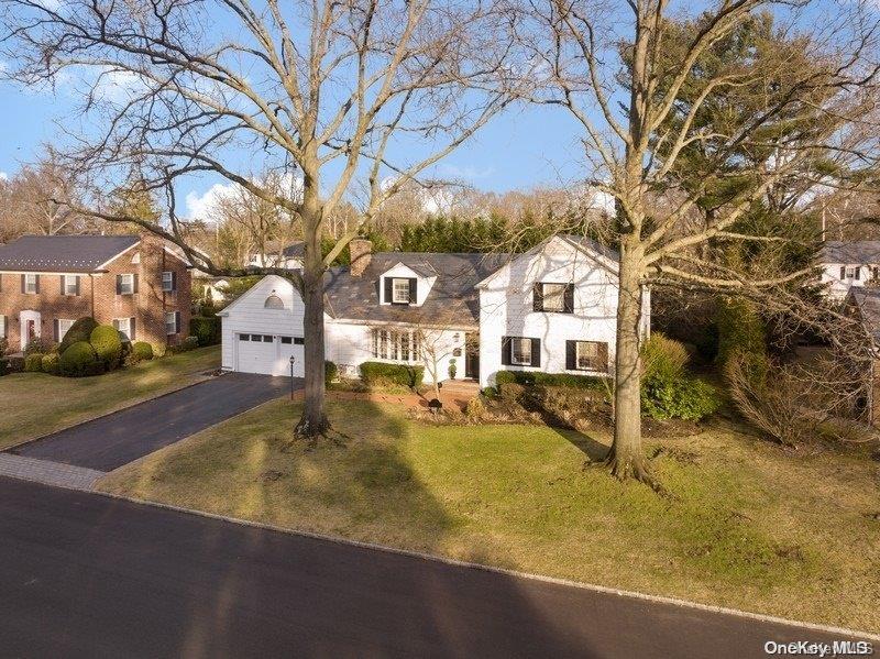 30 Bartlett Drive Manhasset, NY 11030 - Photo 1 of 1 a front view of house with yard and trees