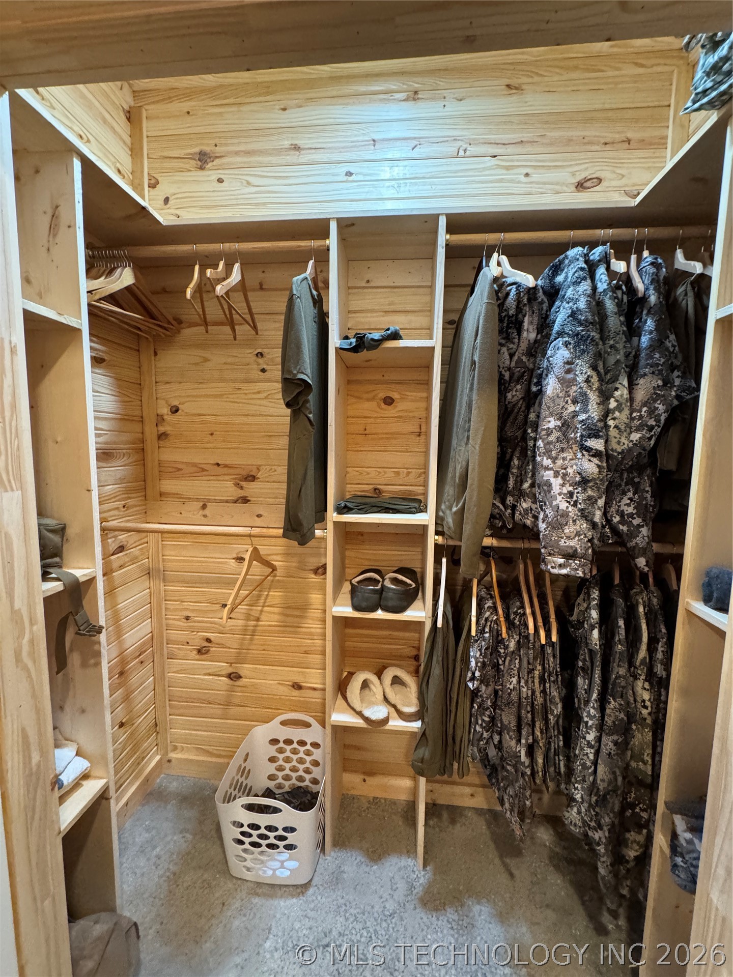 20862 East 1160th Road Keota, OK 74941 - Photo 26 of 47 Walk-in closet with natural wood plank walls and built-in shelving