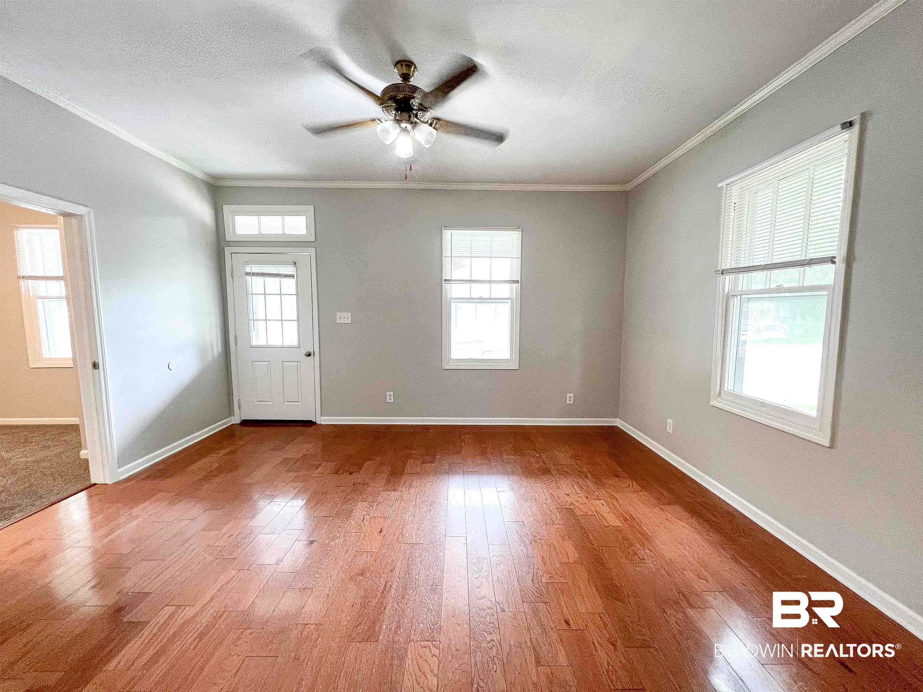 1164 Seneca Street Mobile, AL 36605 - Photo 4 of 22 Entryway with ornamental molding, ceiling fan, baseboards, and wood finished floors