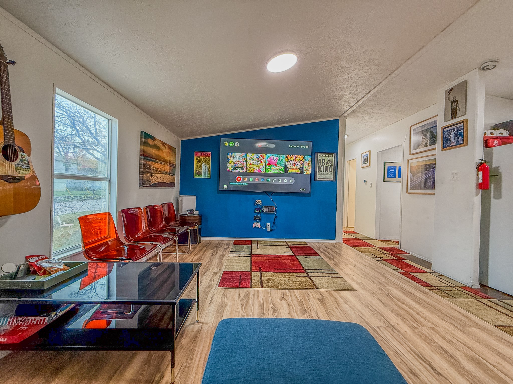 2015 Holly Street Austin, TX 78702 - Photo 3 of 24 Hardwood-style flooring extends through this casual area, offering a relaxed and open atmosphere.