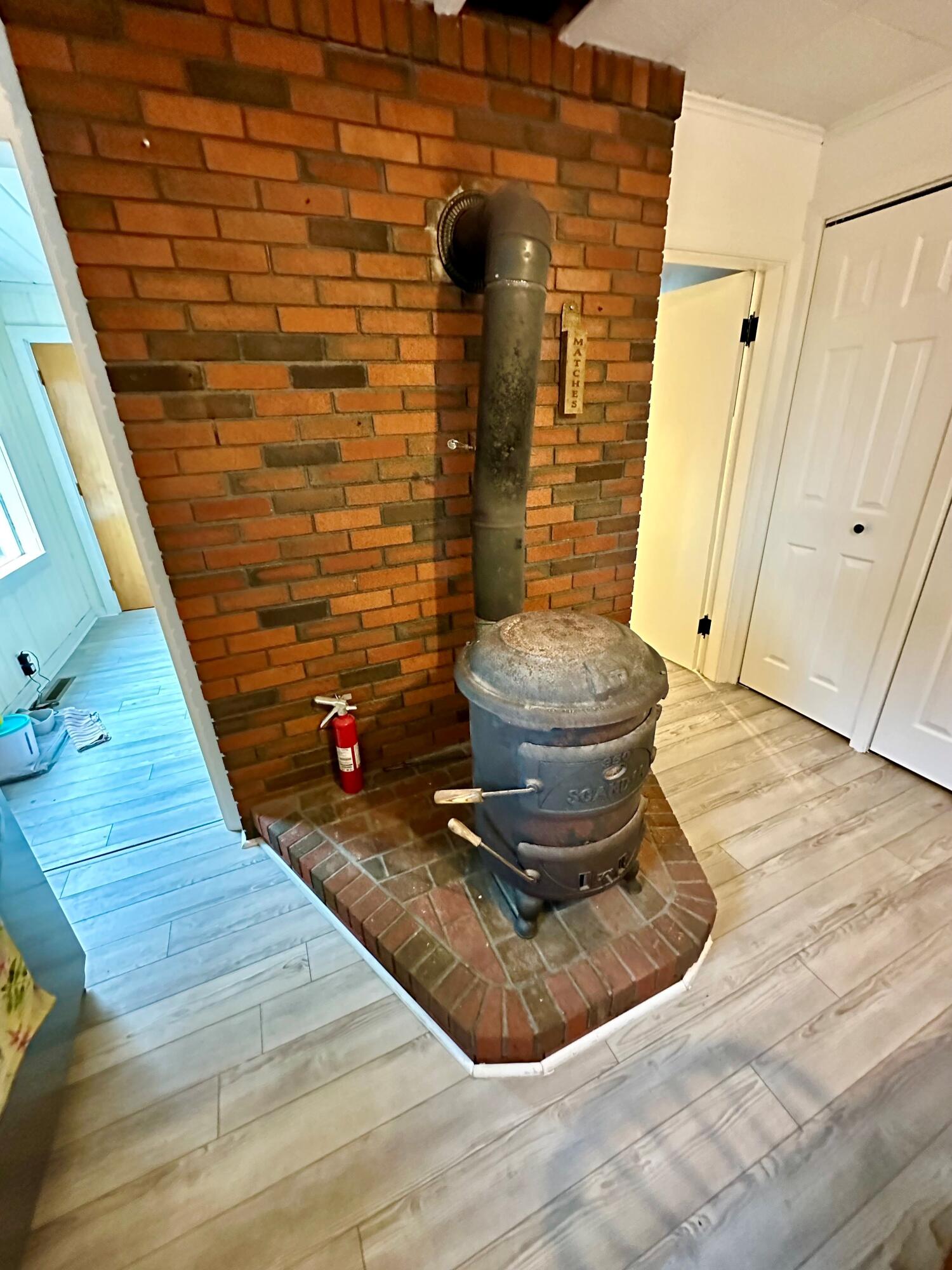 1574 Main Street Mapleton, ME 04757 - Photo 15 of 46 wood stove in Kitchen