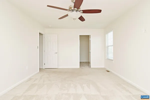 an empty room with fan