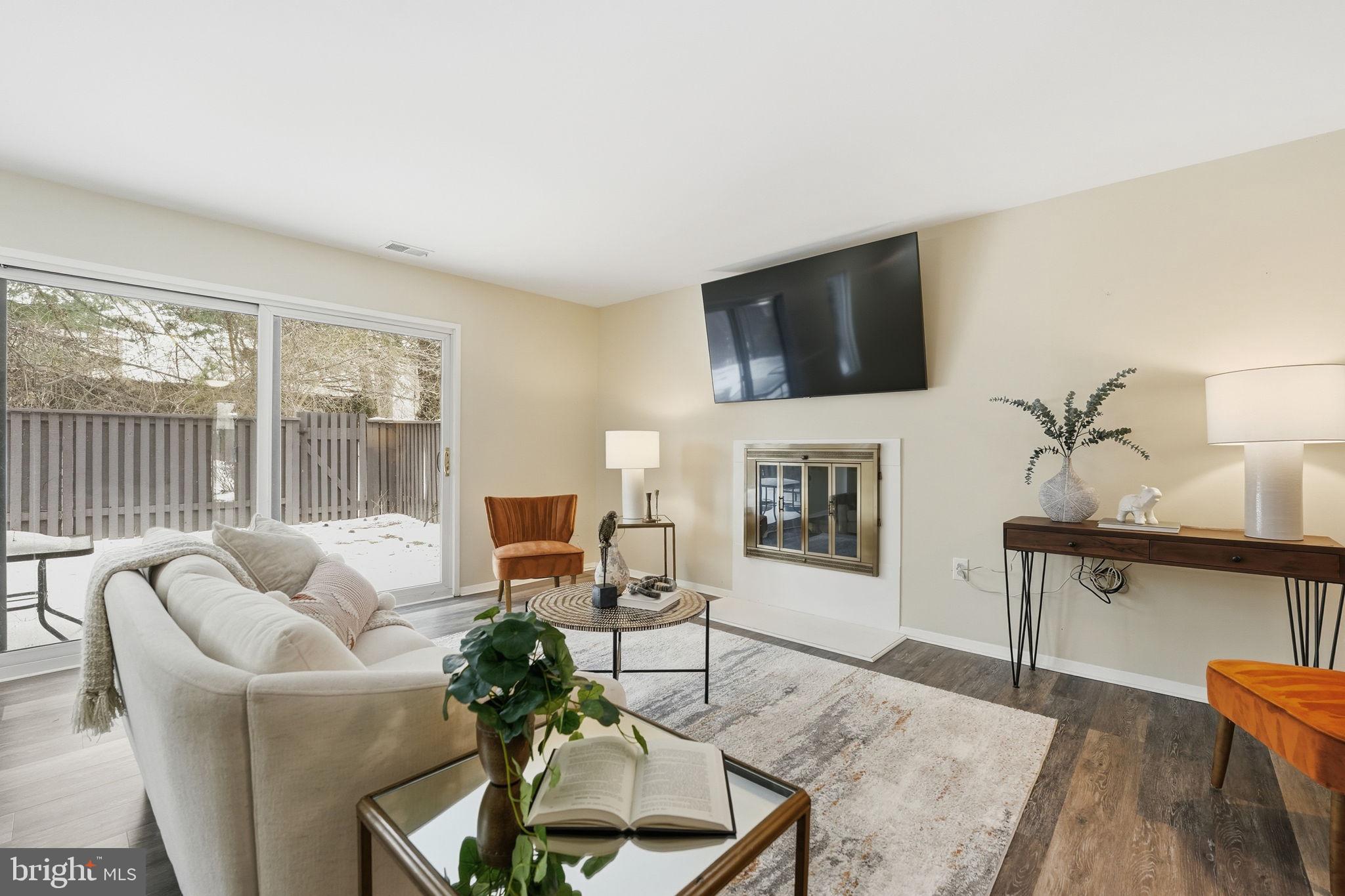 1735 Ivy Oak Square, Unit 7 Reston, VA 20190 - Photo 6 of 37 Living room TV conveys