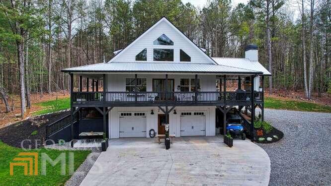 202 Highpoint Ridge Road, Unit 9 Ellijay, GA 30536 - Photo 1 of 1 a view of a house with backyard porch and sitting area
